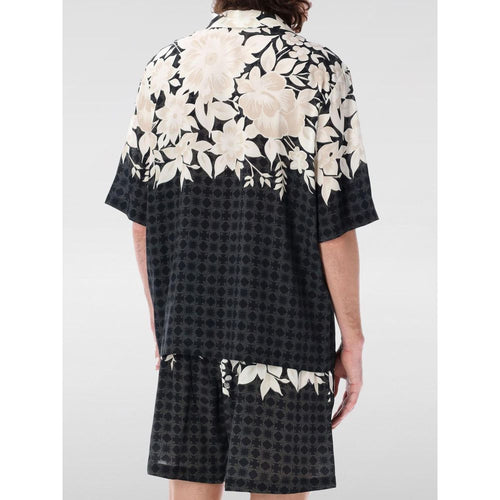 Chemise en soie noire à motif d'Amiri, élégante chemise pour homme avec design sophistiqué visible en image.