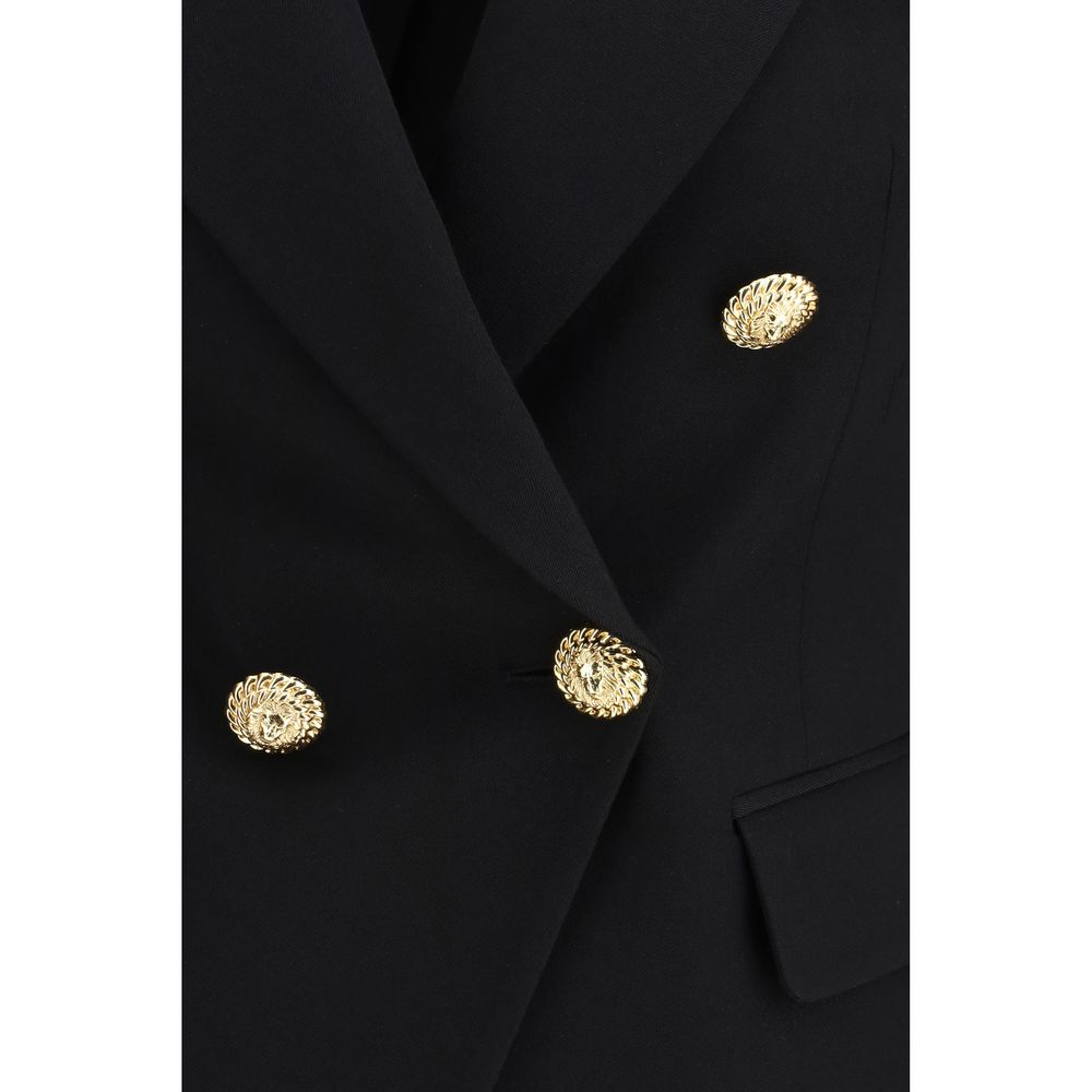Veste blazer noire en laine Balmain Oves Aries avec boutons dorés, ajustée et élégante, vue sur le modèle.