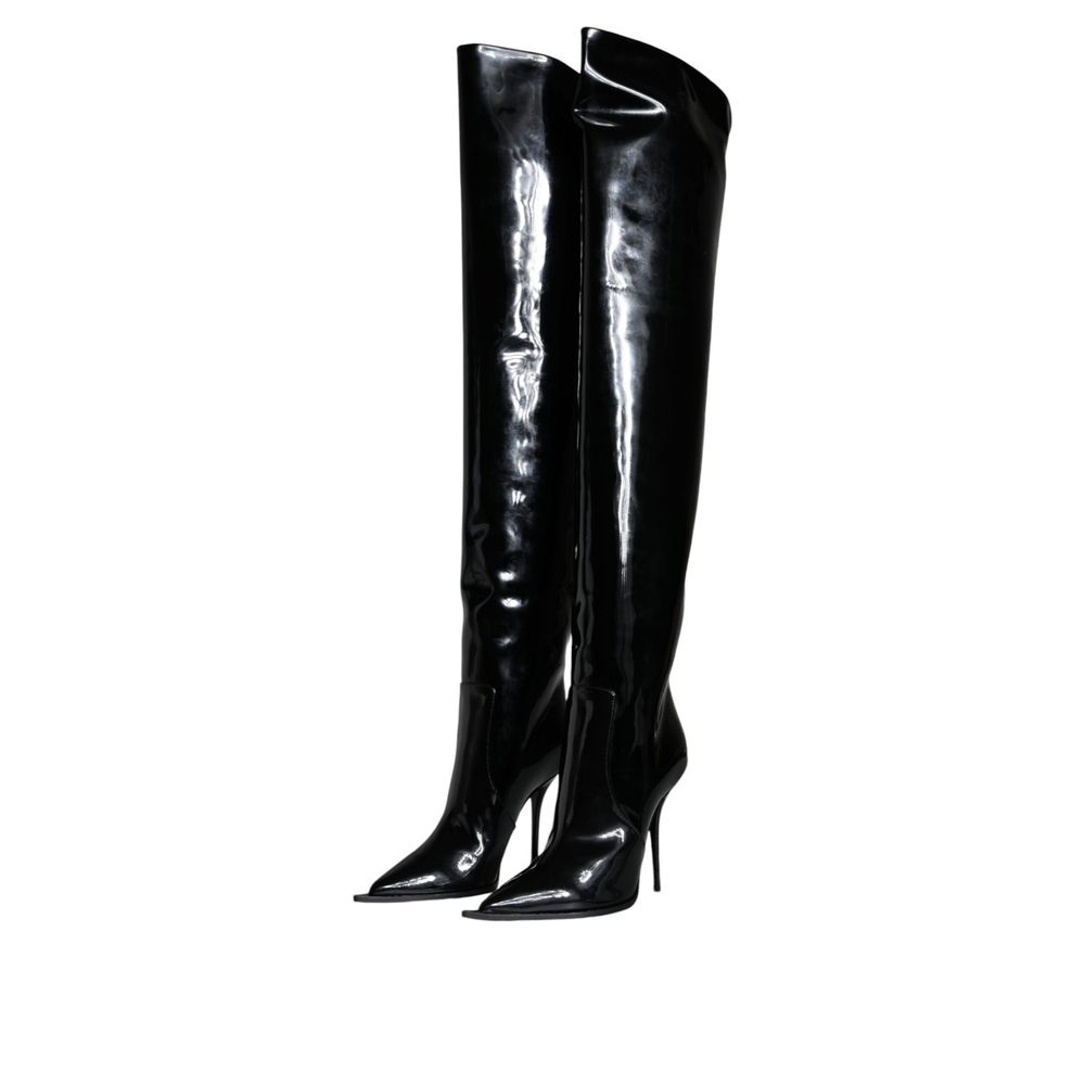 Bottes en cuir noir Dolce & Gabbana, montantes au-dessus du genou, avec finition élégante et design sophistiqué.
