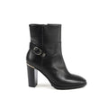 Bottes en cuir noir Tommy Hilfiger pour la cheville, élégantes et confortables, avec boucle décorative sur le côté.
