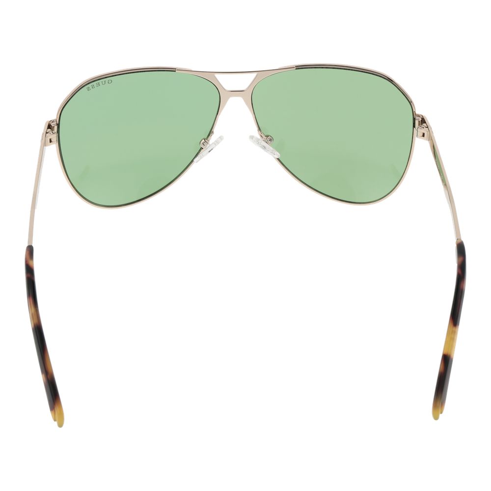 Lunettes de soleil en métal doré Guess, style tendance avec monture fine et verres sombres, pour un look chic et moderne.