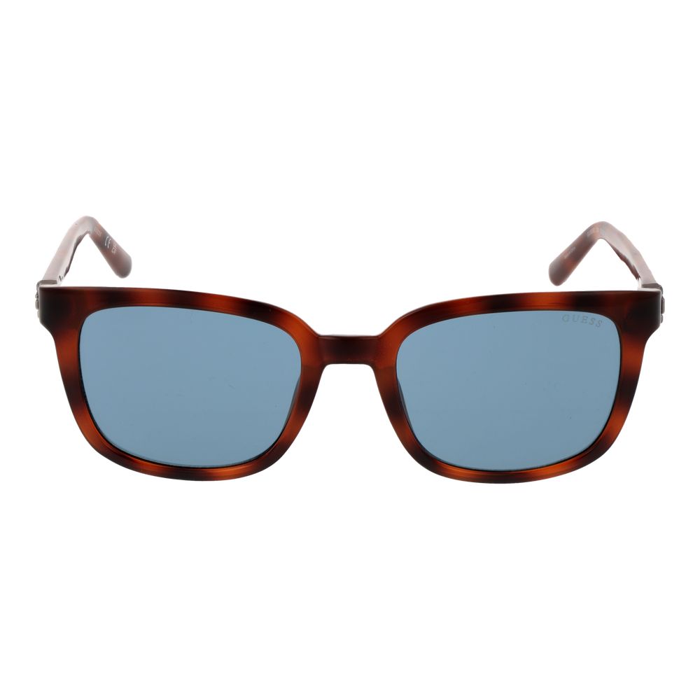 Lunettes de soleil en plastique marron Guess avec monture élégante et verres teintés pour un style tendance.