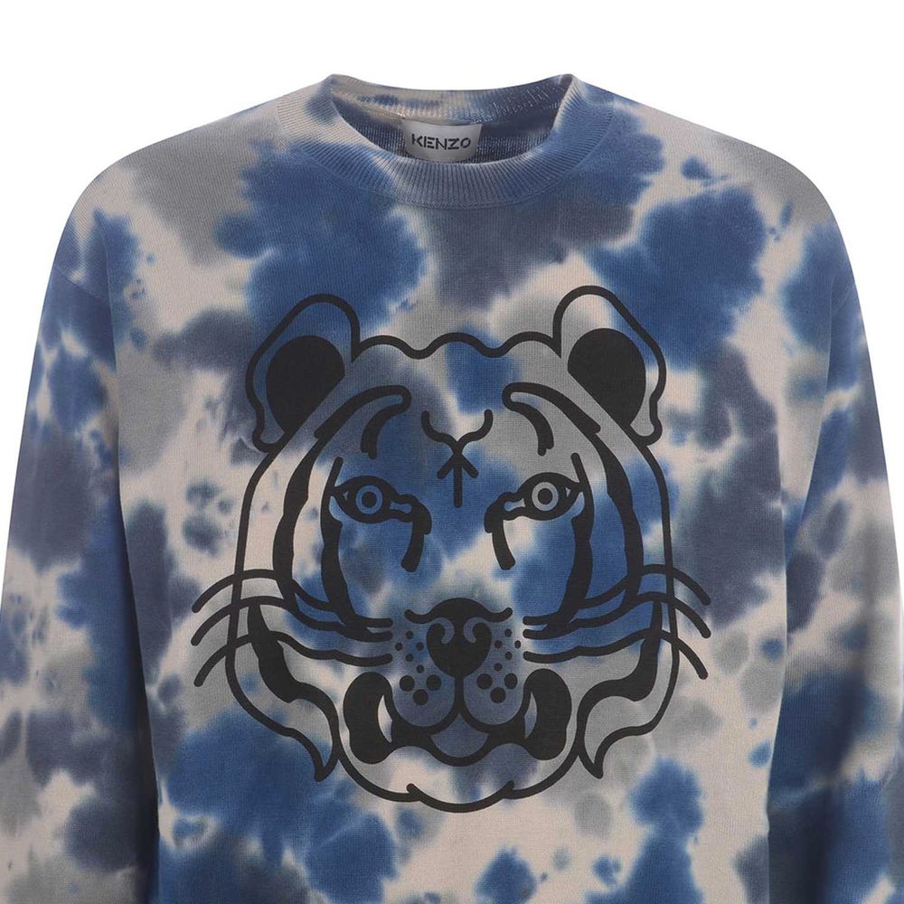 Sweatshirt en coton gris de la marque Kenzo, à capuche avec logo discret, portée décontractée et confortable.