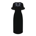Robe décontractée noire en viscose de Fendi, coupe fluide et élégante, portée avec des détails subtils.