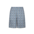 Jupe en soie bleue Fendi mi-longue, élégante et fluide, portée avec un style sophistiqué.