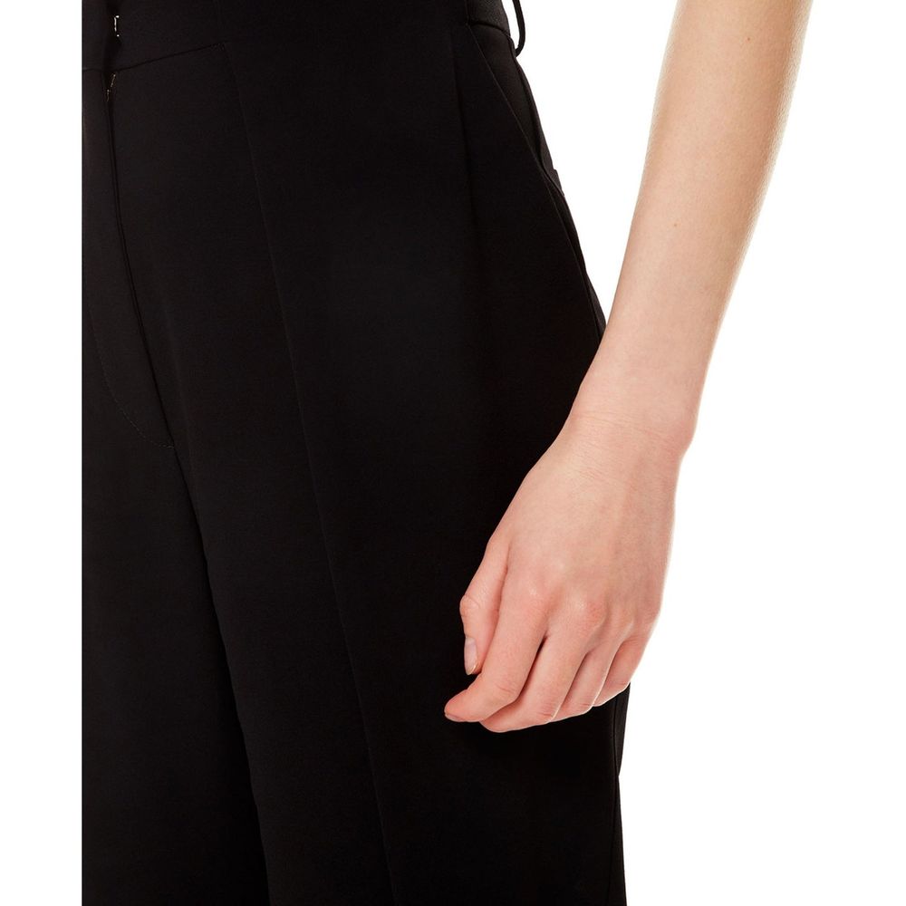Pantalons décontractés noirs en viscose de Balmain, coupe confortable et style élégant, visibles dans l'image.