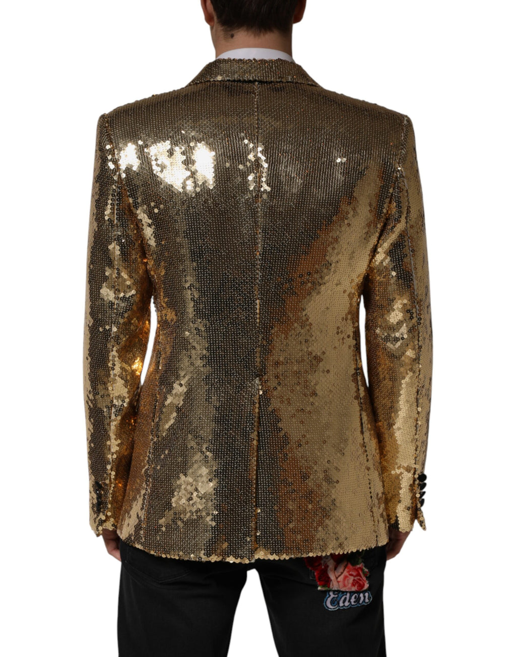Veste blazer double boutonnage en sequins dorés de Dolce & Gabbana, élégante et brillante, avec col et poches visibles.