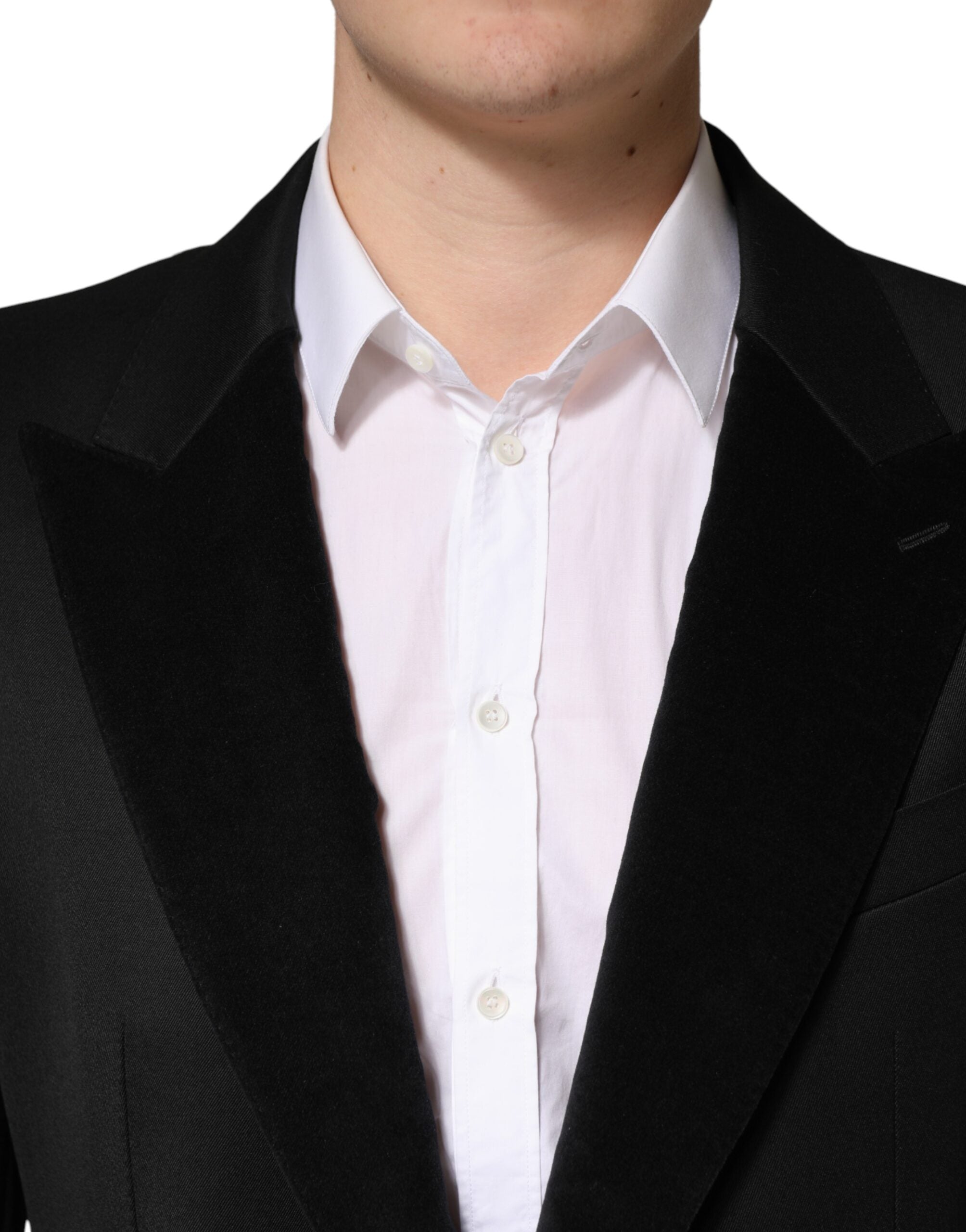 Veste blazer en laine noire Dolce & Gabbana à un seul bouton, coupe élégante, détails raffinés, sur mannequin.