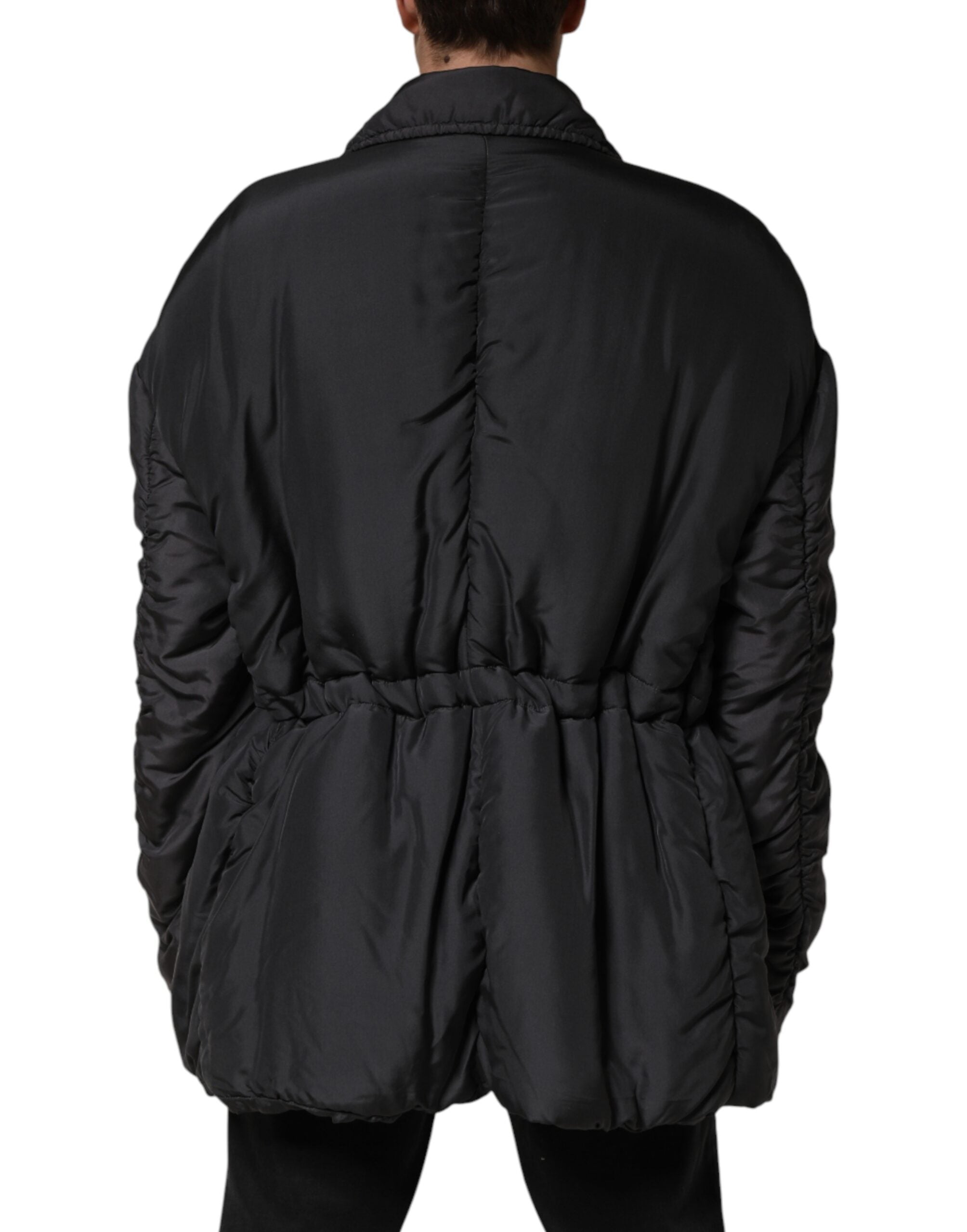 Veste parka pour homme Dolce & Gabbana en soie noire, matelassée, avec capuche et fermeture éclair.