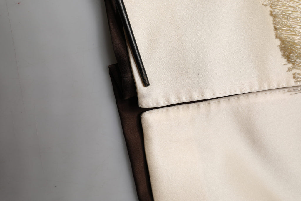 Robe de bain marron crème Dolce & Gabbana avec ceinture, style lounge et veste en tissu doux, vue de face.