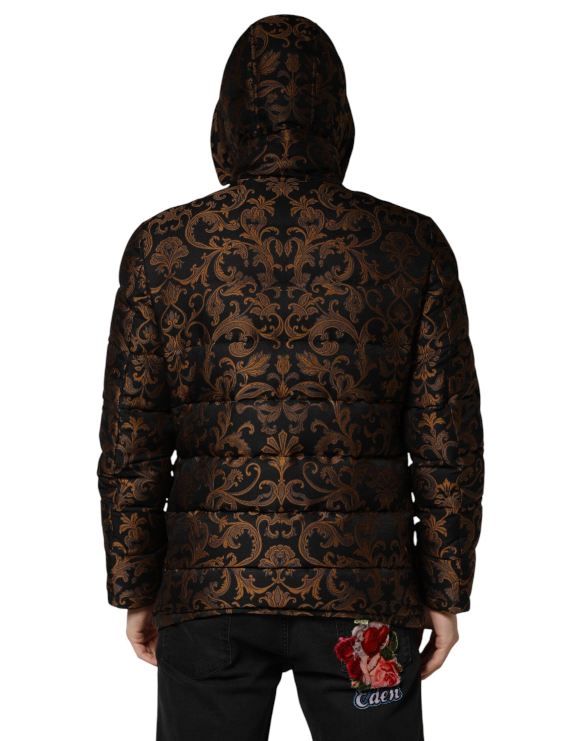 Veste matelassée noire Dolce & Gabbana avec motif floral jacquard et capuche, élégante et tendance.