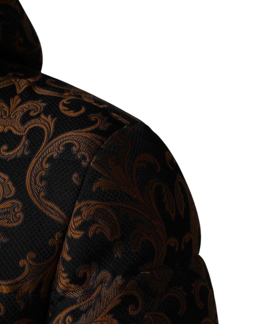 Veste matelassée à capuche Dolce & Gabbana noire avec motif floral jacquard, style élégant et moderne.