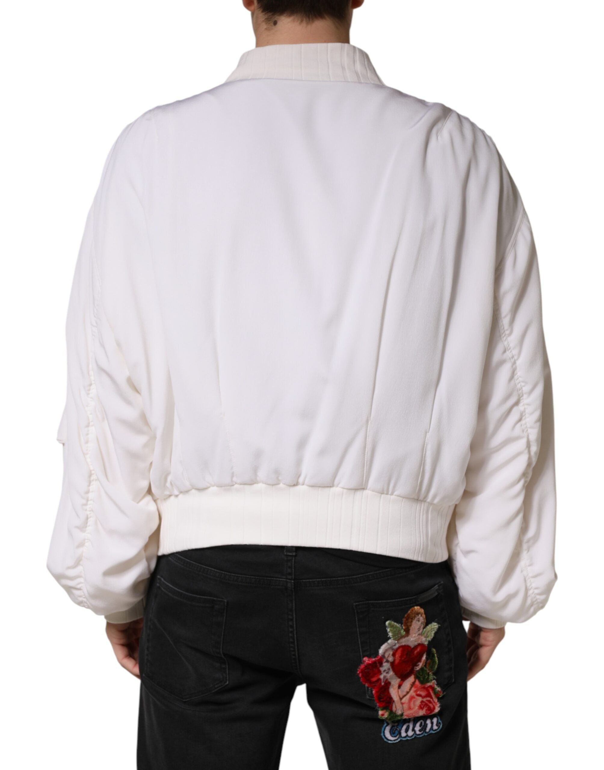Veste bomber blanche en soie Dolce & Gabbana avec fermeture éclair complète, style élégant et sophistiqué.