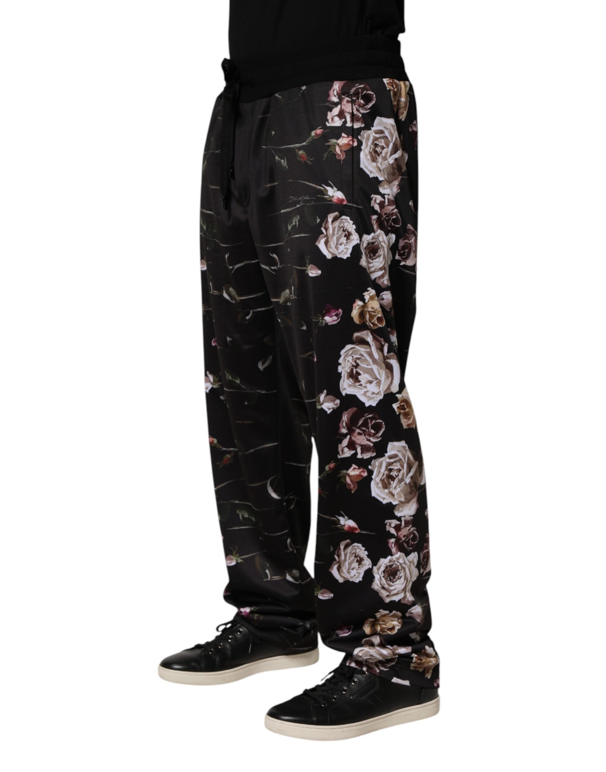 Pantalon chino droit noir Dolce & Gabbana avec motif floral, style élégant et coupe classique, visible en gros plan.