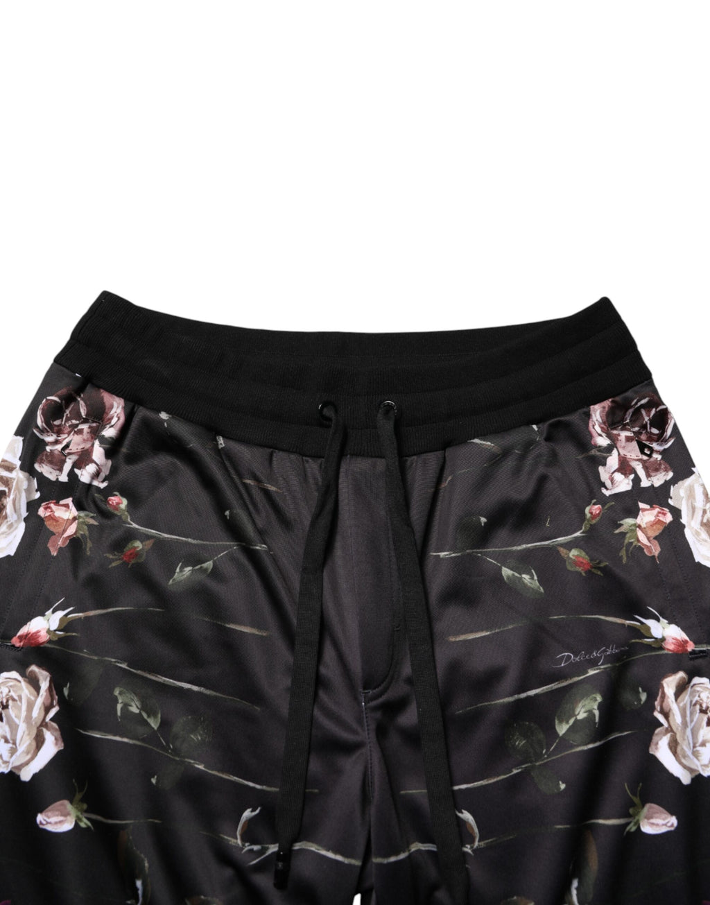 Pantalon chino noir à fleurs Dolce & Gabbana, coupe droite, style élégant, visible avec détails floraux et finition soignée.
