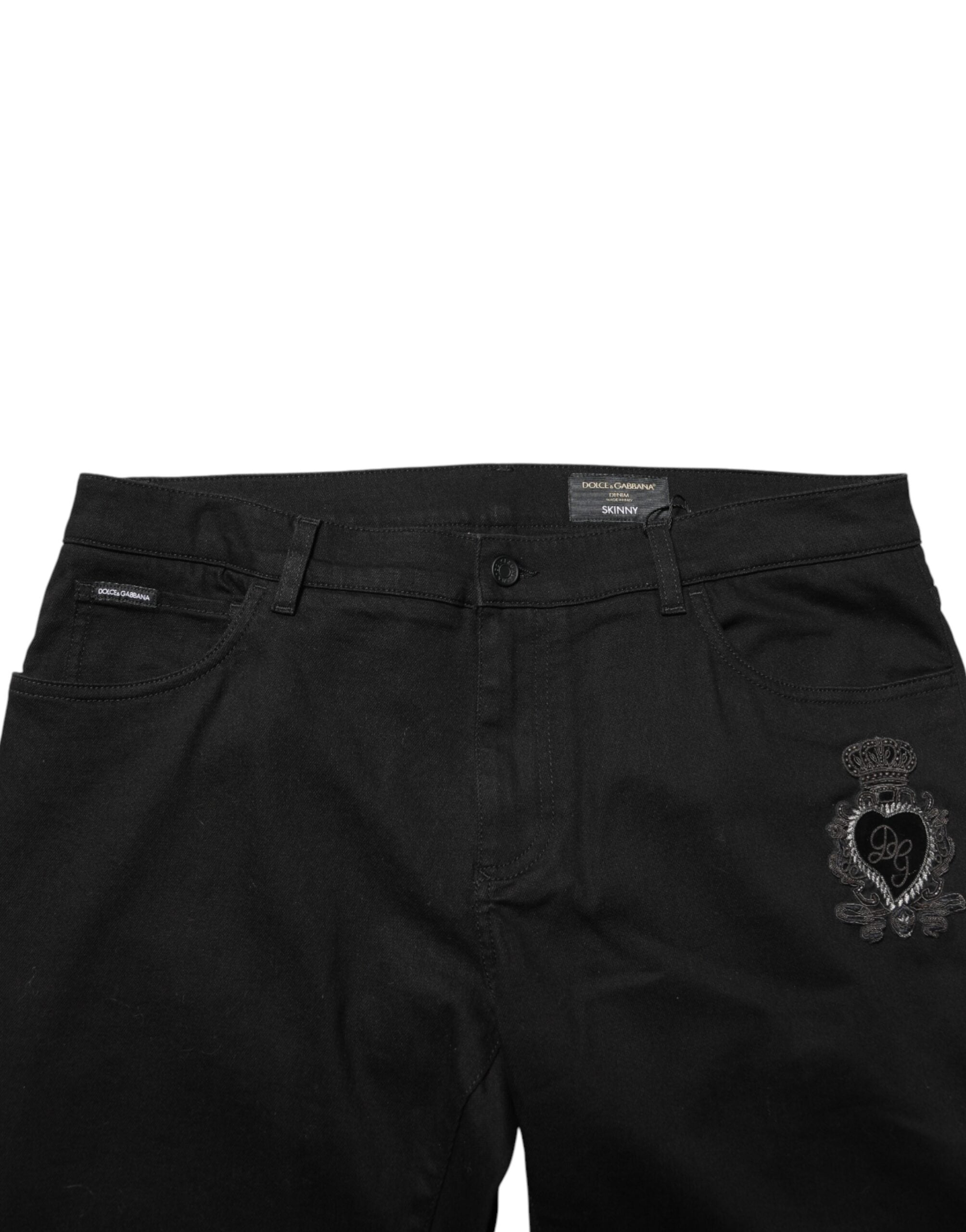 Jeans skinny noirs Dolce & Gabbana Sacred Heart pour homme, denim avec détails de cœur sacré visible.