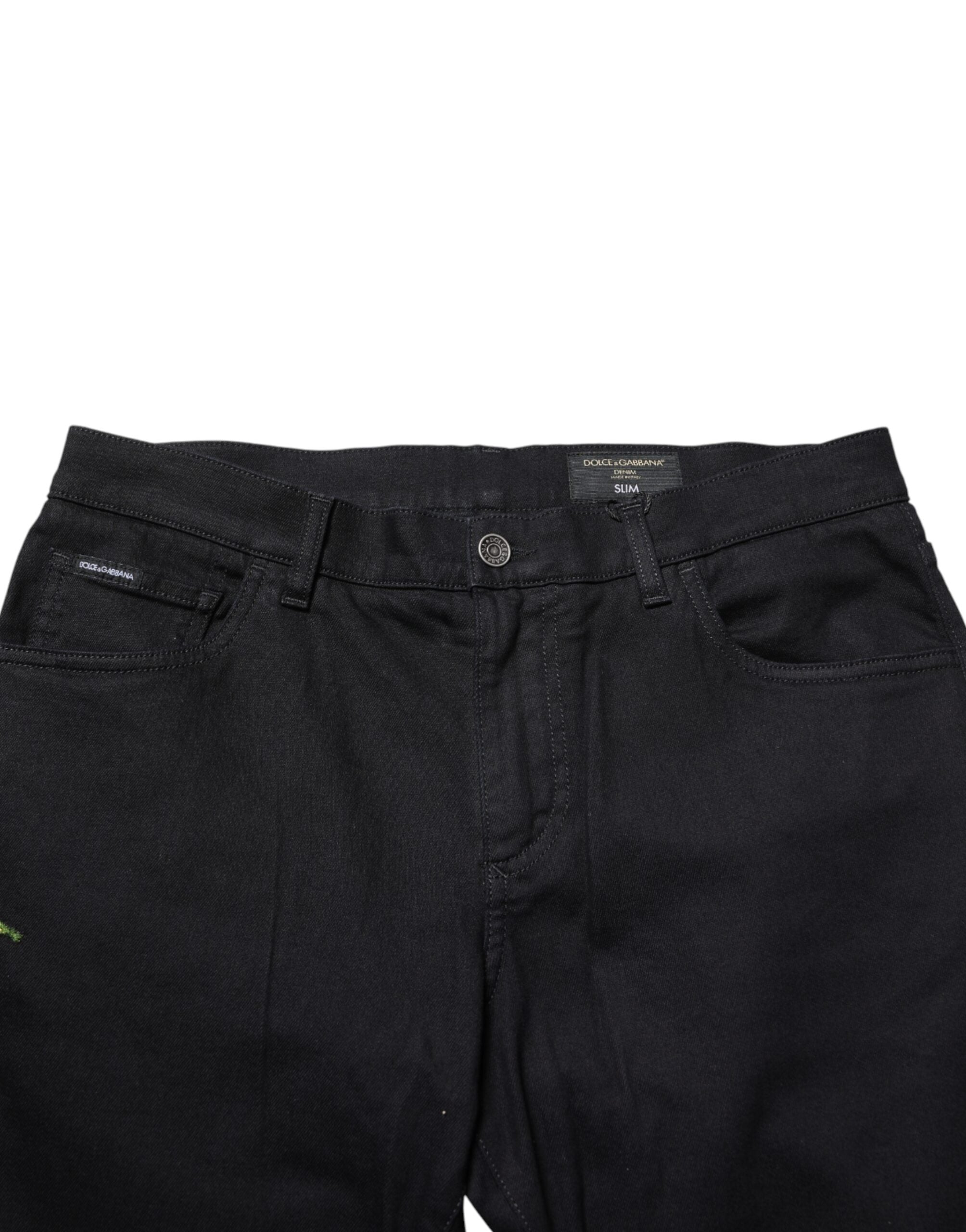 Jean skinny homme Dolce & Gabbana en denim noir à motifs floraux en coton, style élégant et moderne.