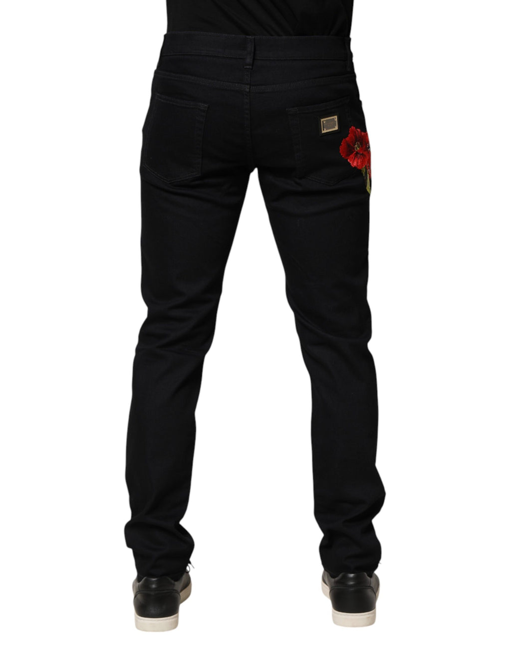 Jeans homme Dolce & Gabbana en coton noir avec motif floral, coupe skinny, en denim élégant et tendance.