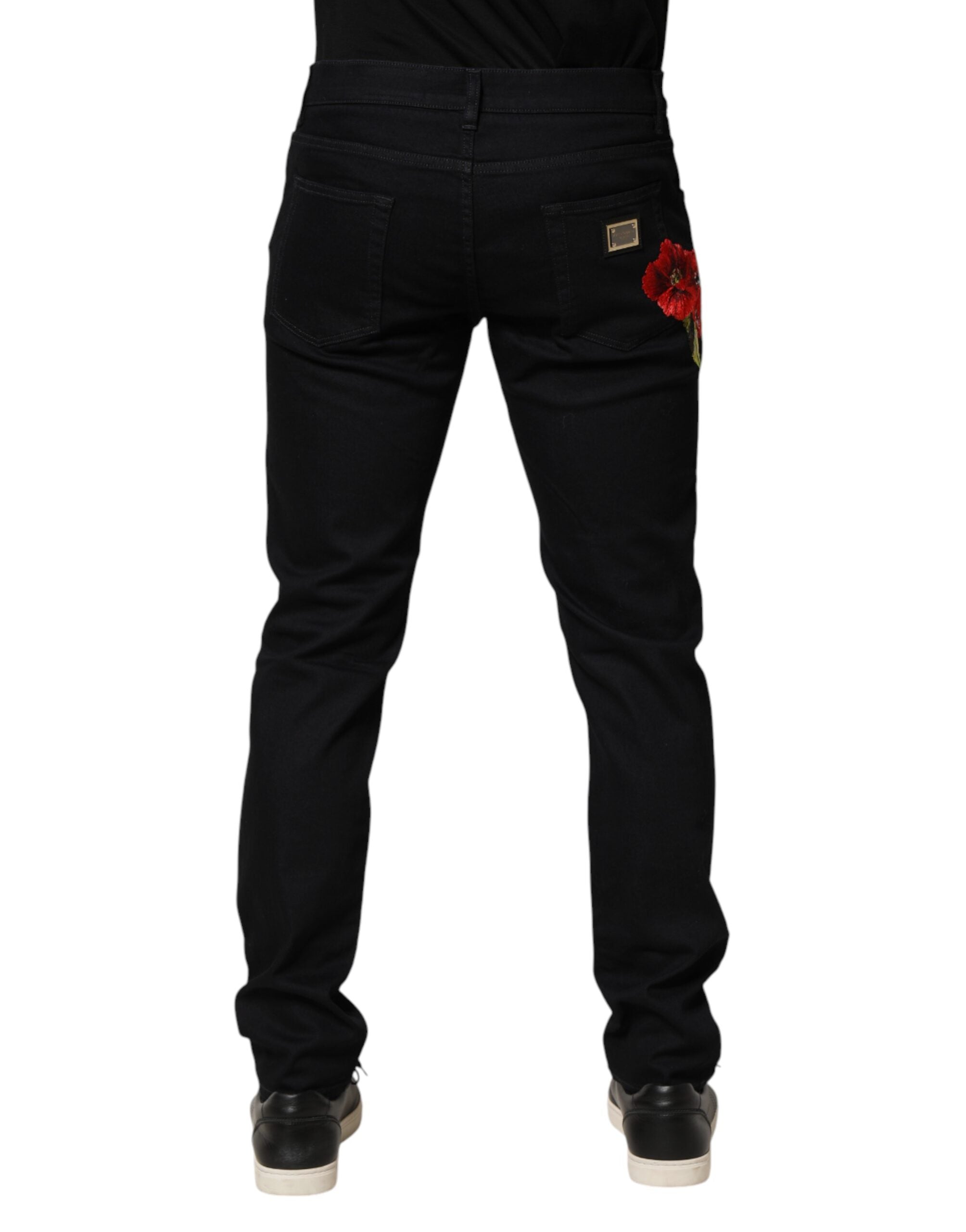 Jeans homme Dolce & Gabbana en coton noir avec motif floral, coupe skinny, en denim élégant et tendance.