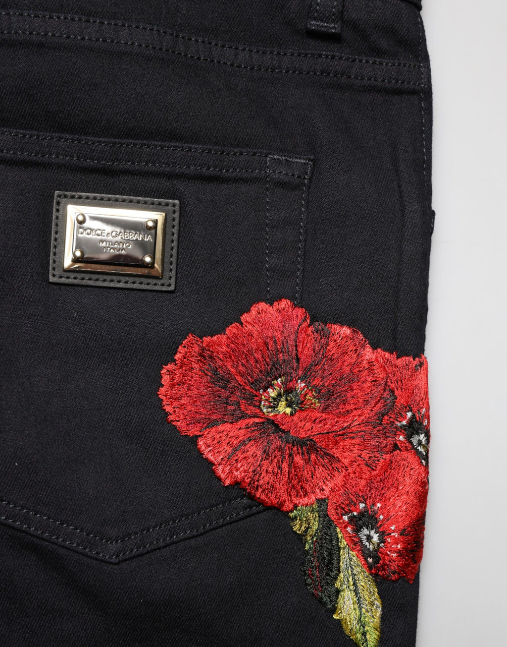 Jeans homme skinny en denim noir à fleurs de Dolce & Gabbana, coton, avec détails floraux.