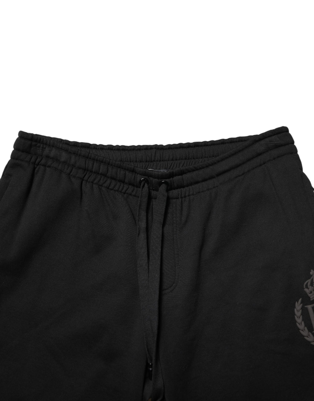 Pantalon jogger skinny en coton noir Dolce & Gabbana avec logo, style décontracté et ajusté, vue de face.