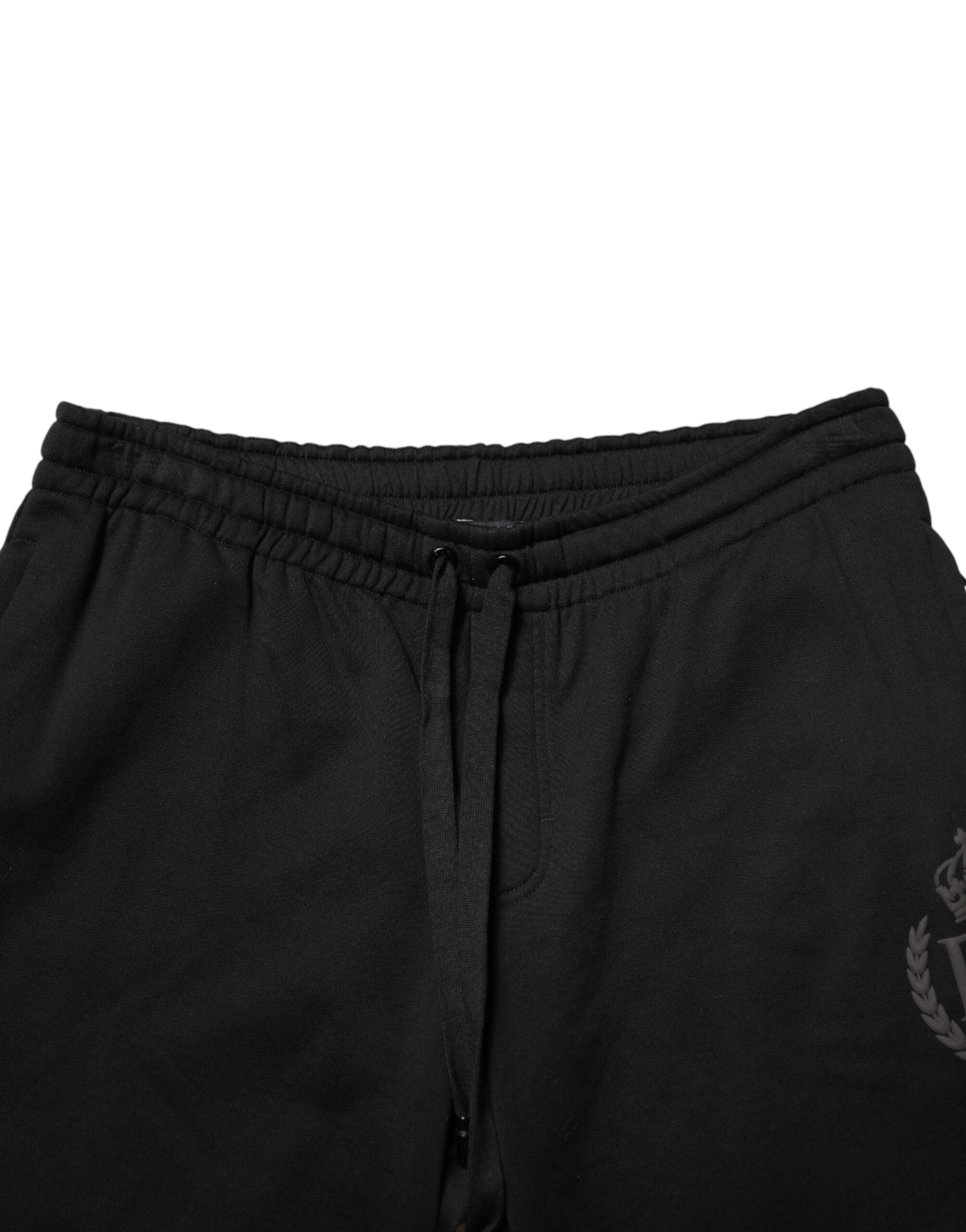 Pantalon jogger skinny en coton noir Dolce & Gabbana avec logo, style décontracté et ajusté, vue de face.