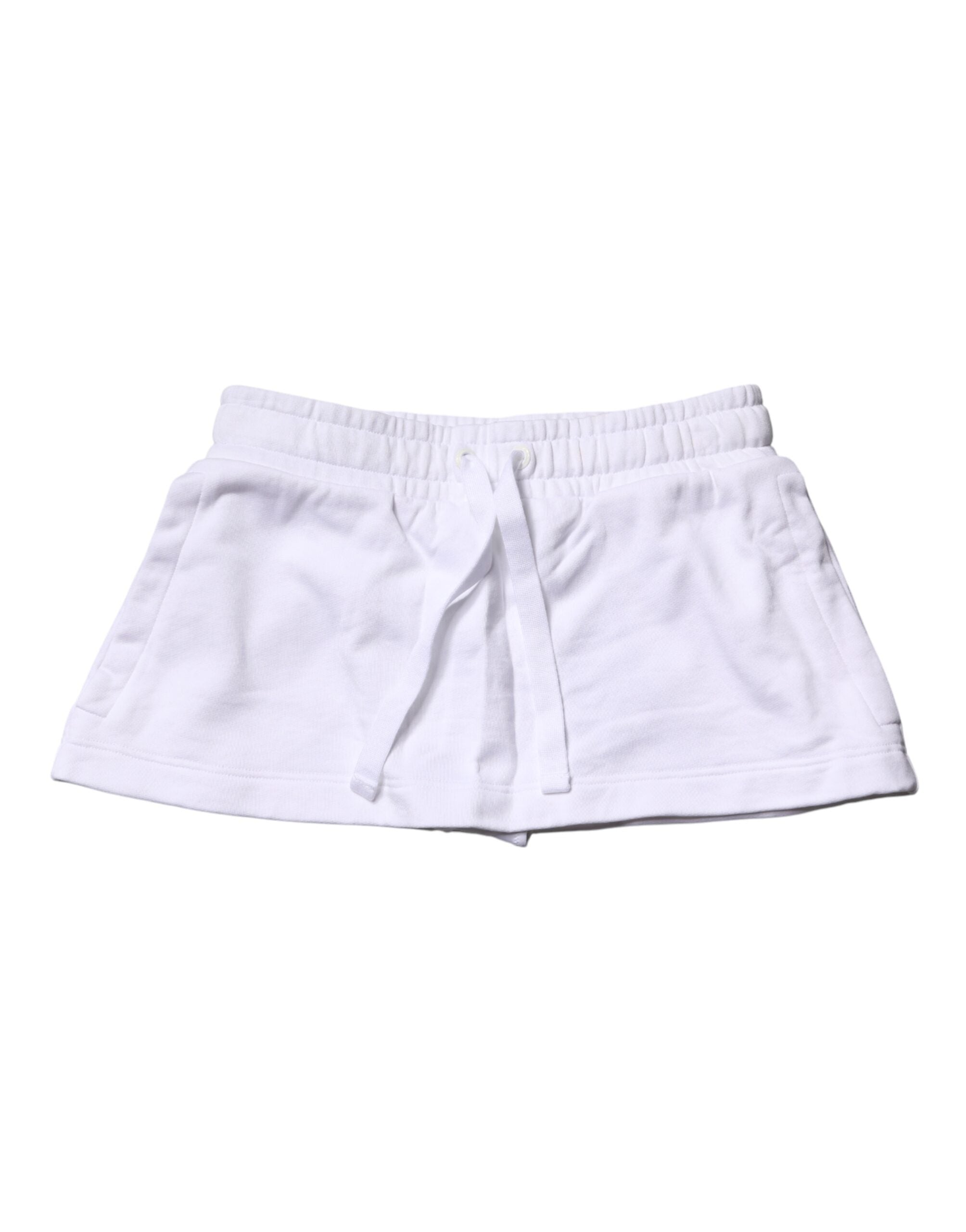 Jupe courte en coton blanc Dolce & Gabbana, taille moyenne, coupe évasée, style mini tendance, vue de face sur mannequin.