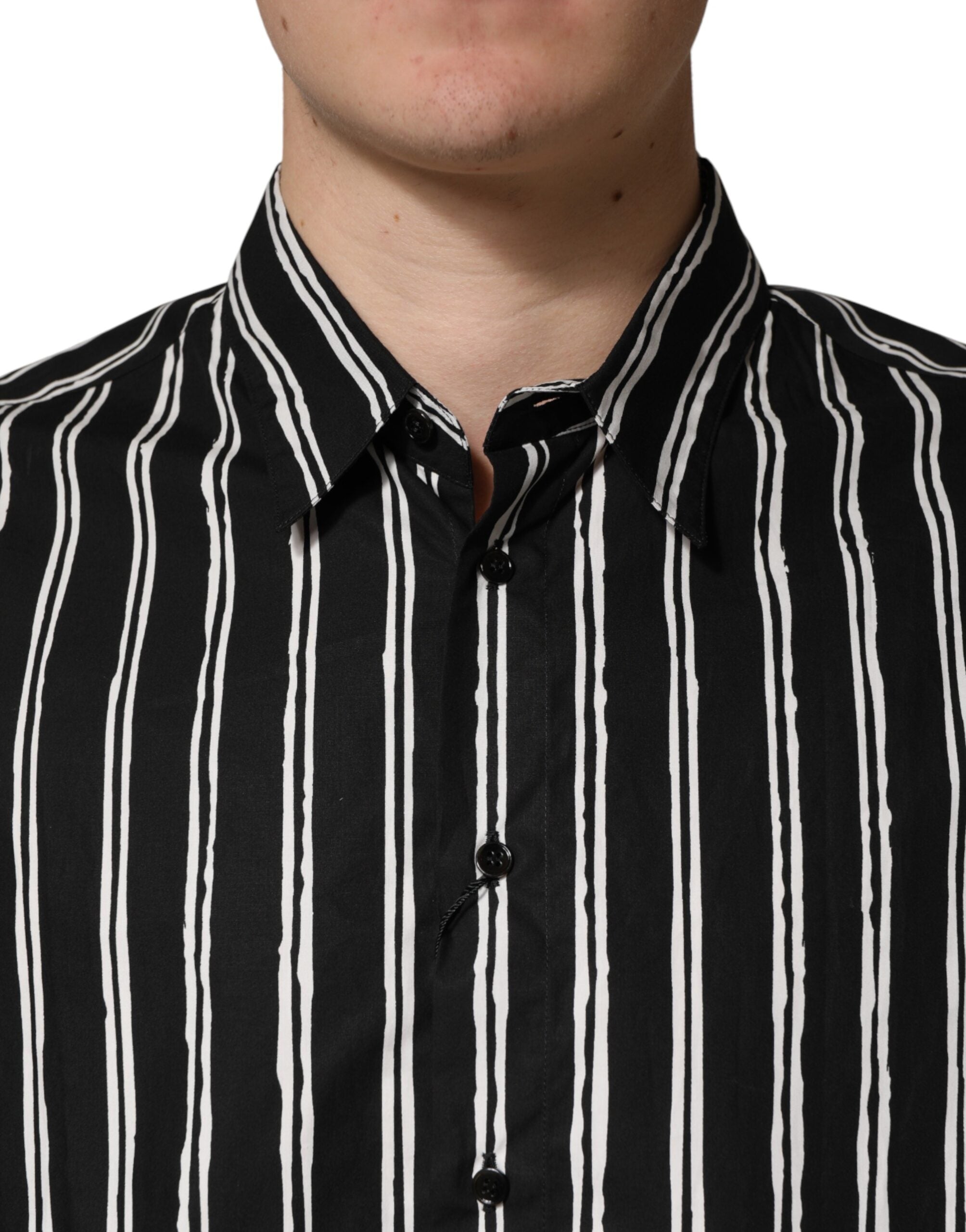 Chemise homme Dolce & Gabbana en coton à rayures noires, costume formel élégant, vue de face sur fond neutre.