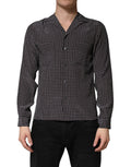 Chemise pour homme en soie noire à motifs de Dolce & Gabbana, boutonnière classique et design élégant.