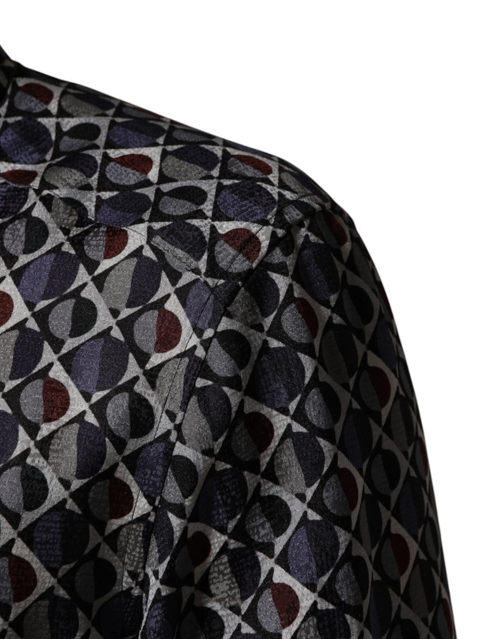 Chemise homme Dolce & Gabbana à col avec motif multicolore et détails dorés, style élégant et sophistiqué.