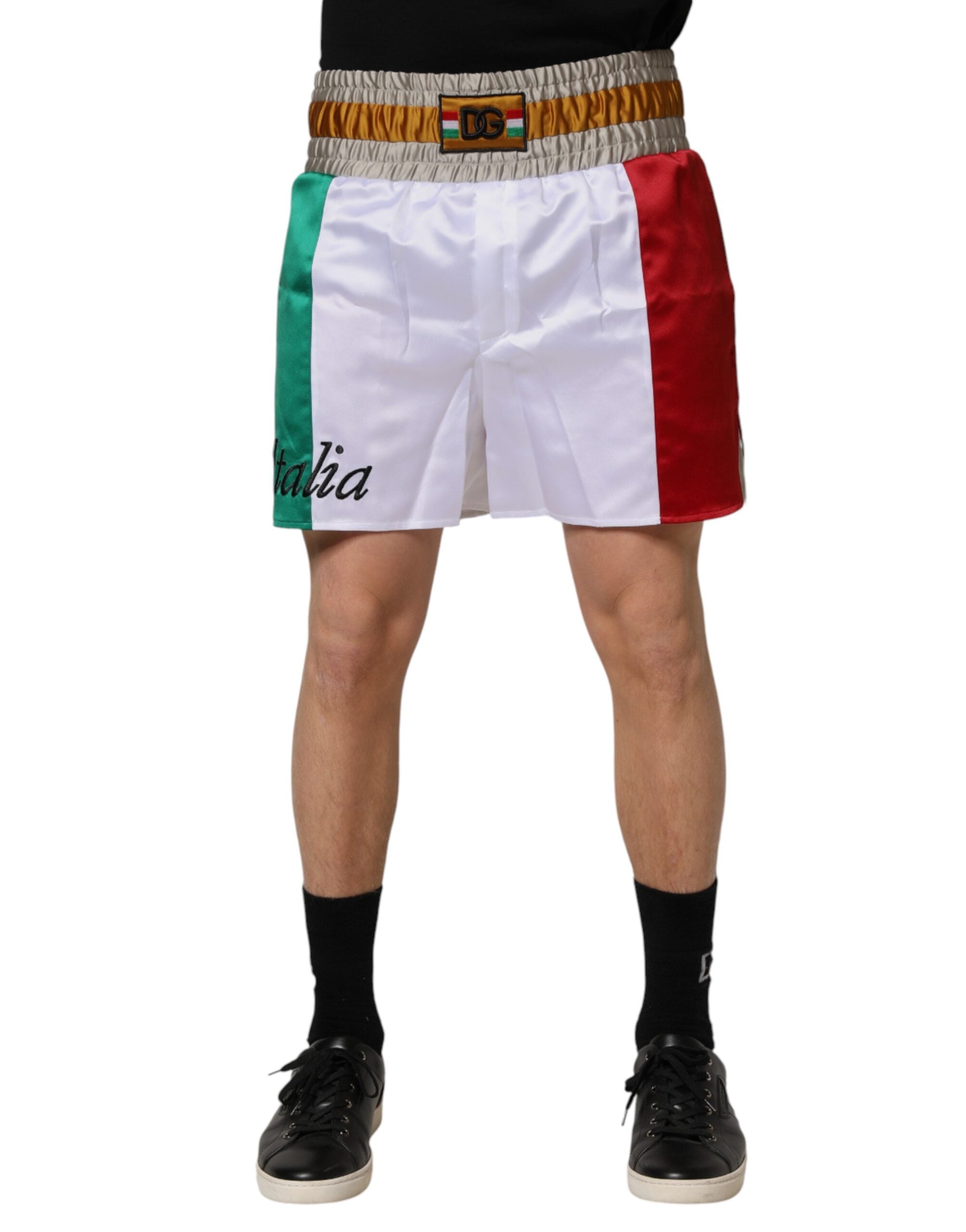 Shorts Bermuda multicolores en polyester Dolce & Gabbana, motif Italia, vue de face avec ceinture et détails colorés.