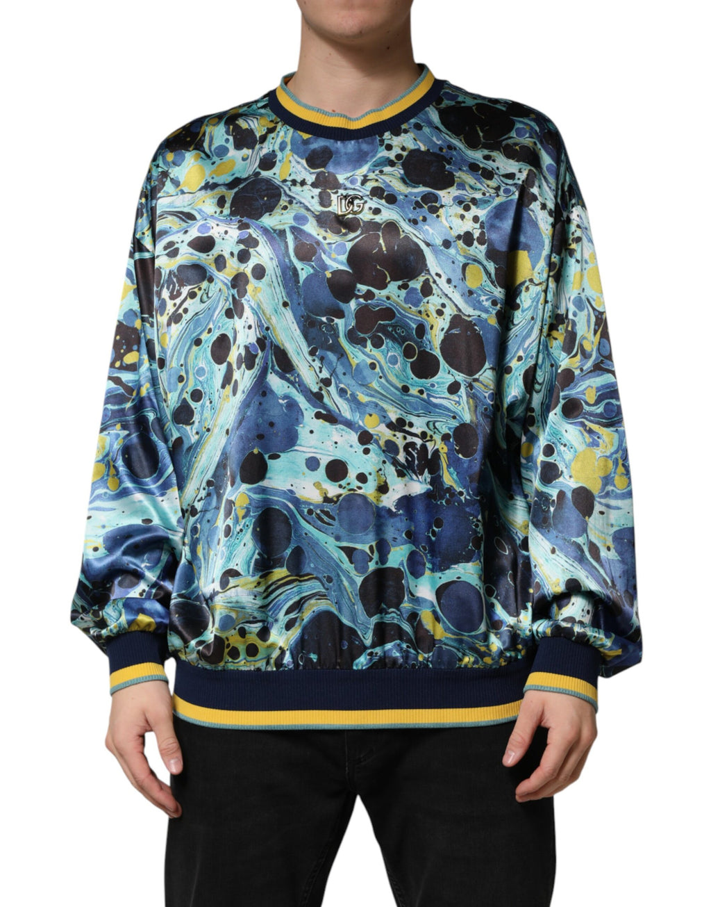 Pull en cachemire Dolce & Gabbana à imprimé marbré multicolore, vue de face, mettant en valeur les motifs colorés et la texture douce.