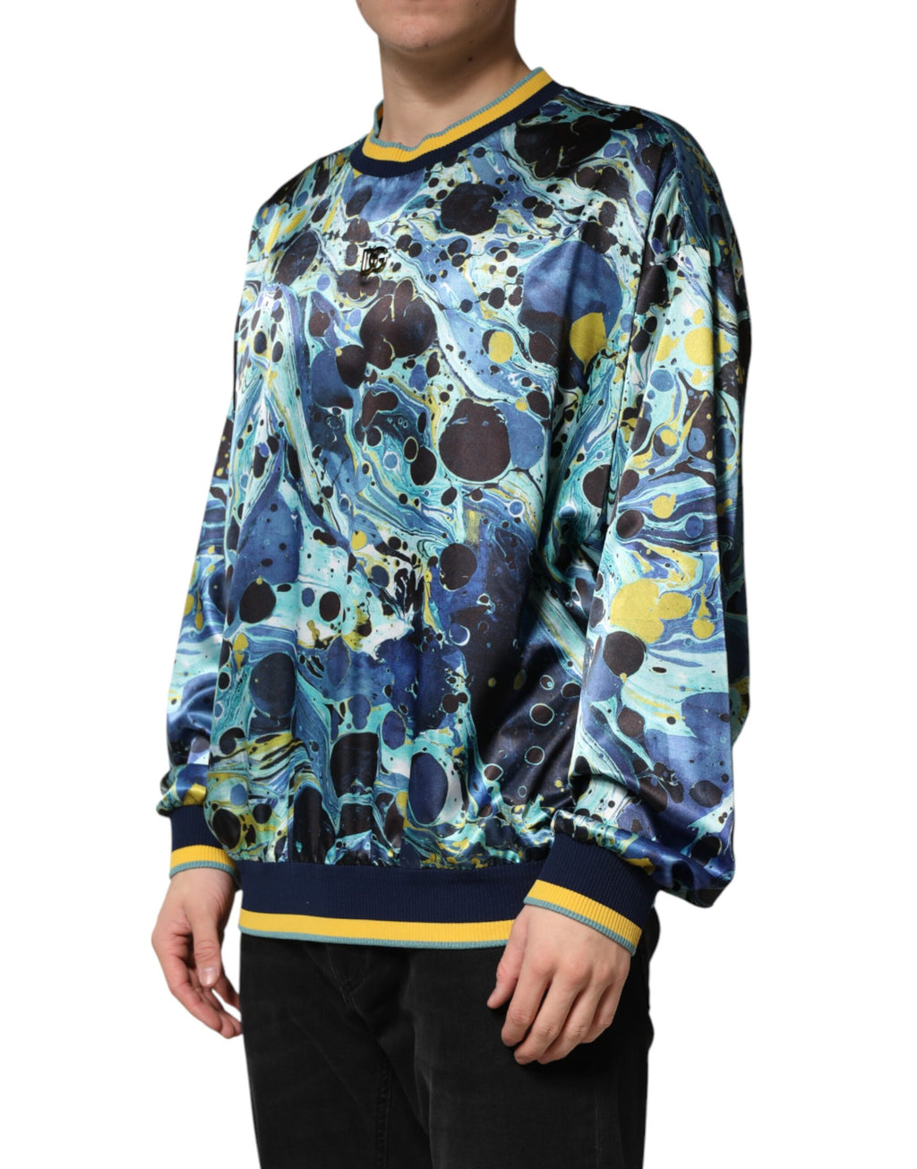 Pull en maille Dolce & Gabbana à motif marbre multicolore, design élégant et coloré.