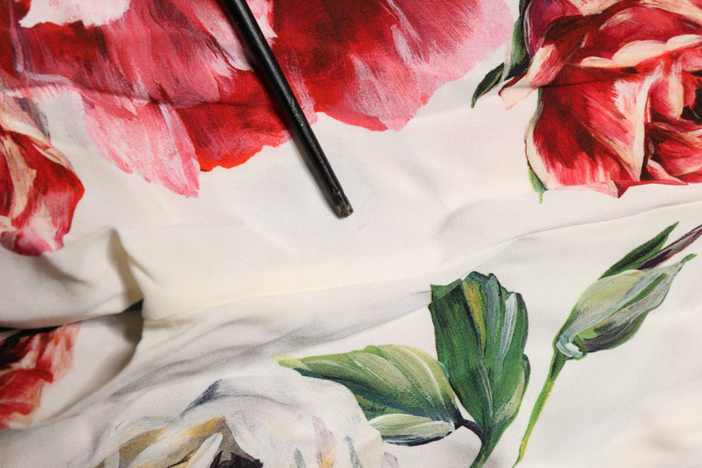 Leggings blanches Dolce & Gabbana à fleurs avec taille extensible, pantalon stretch élégant pour femmes.