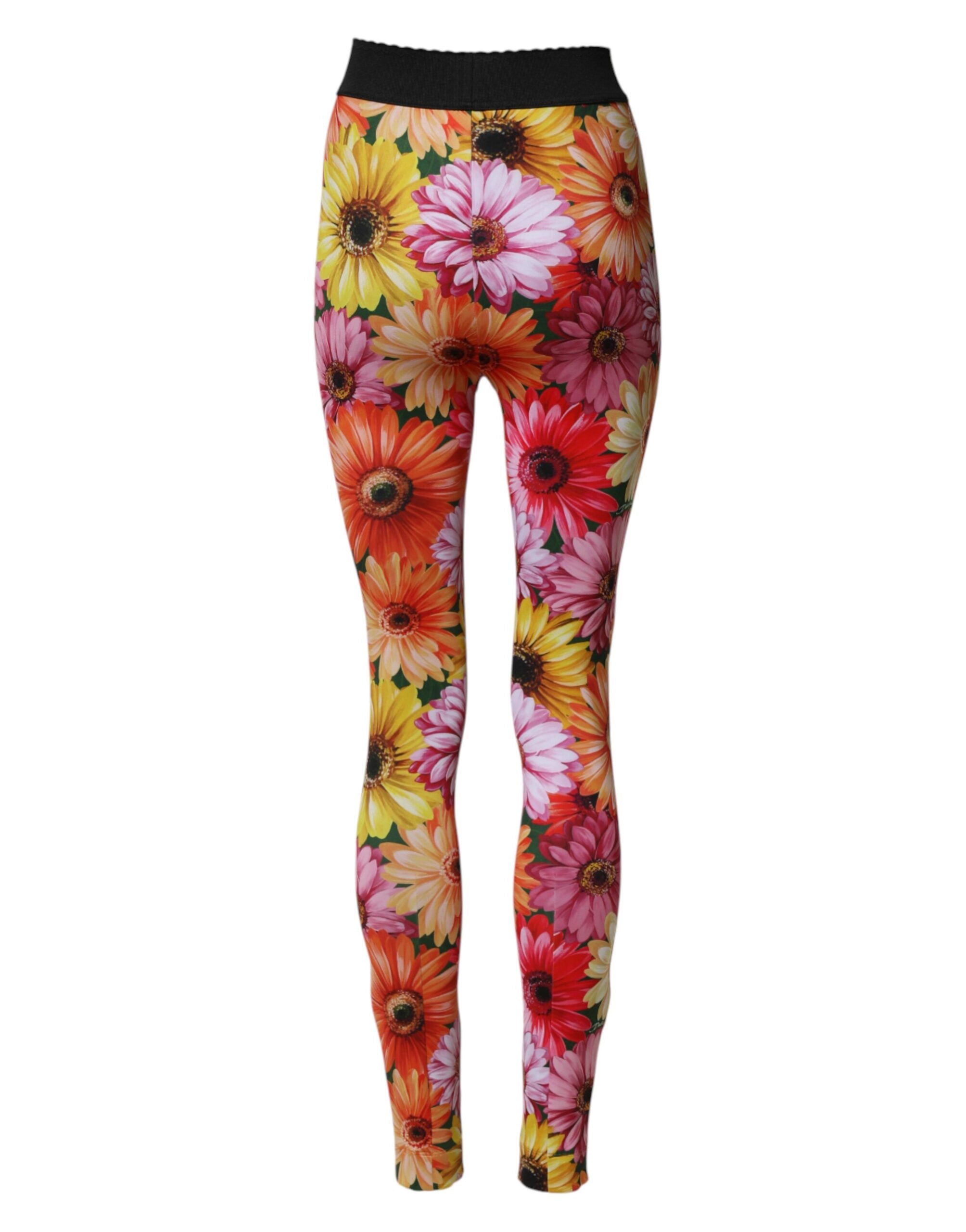 Leggings fleuries multicolores Dolce & Gabbana en tissu stretch, taille élastique, avec motif floral vibrant visible sur l'image.