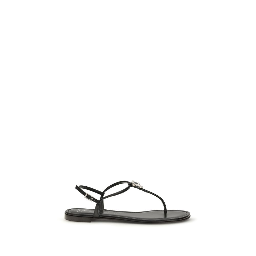 Sandales plates en cuir de veau noir Giuseppe Zanotti Bos Taurus, visibles avec leur design élégant et confort.