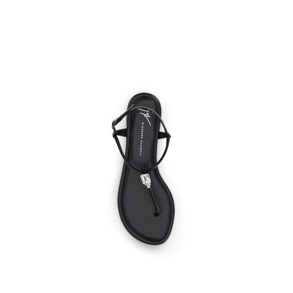 Sandales plates en cuir de veau noir Giuseppe Zanotti Bos Taurus, vues de côté avec bride élégante et semelle plate.