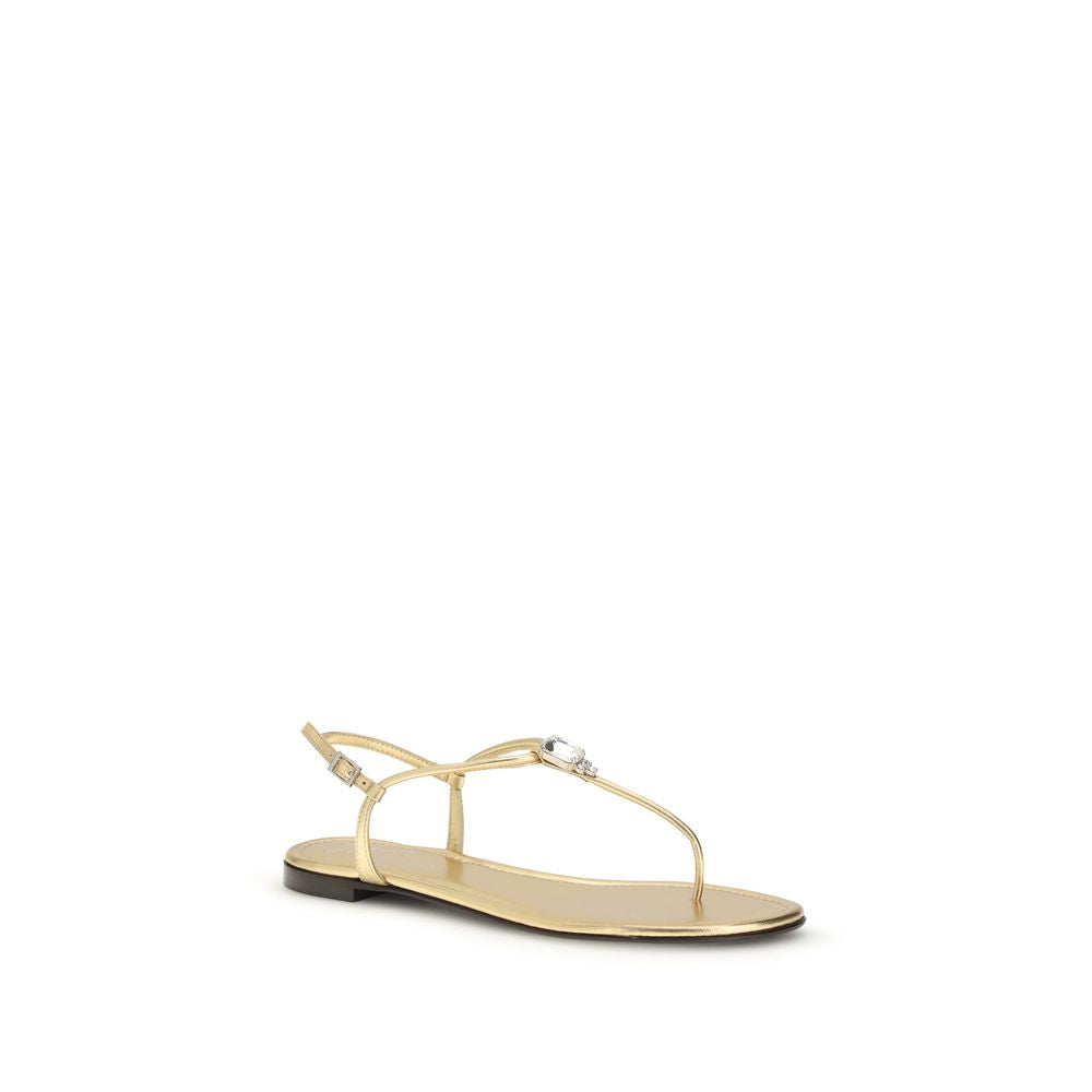 Sandales plates en cuir de veau doré Giuseppe Zanotti Bos Taurus, visibles avec leur design élégant et finition raffinée.