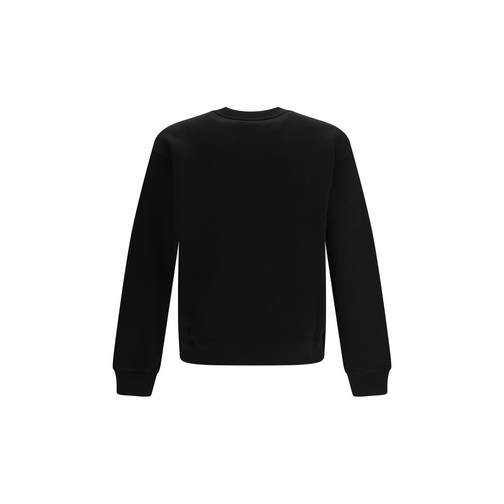 Sweatshirt en coton noir de la marque Kenzo, vêtement décontracté avec logo discret, porté sur un mannequin.