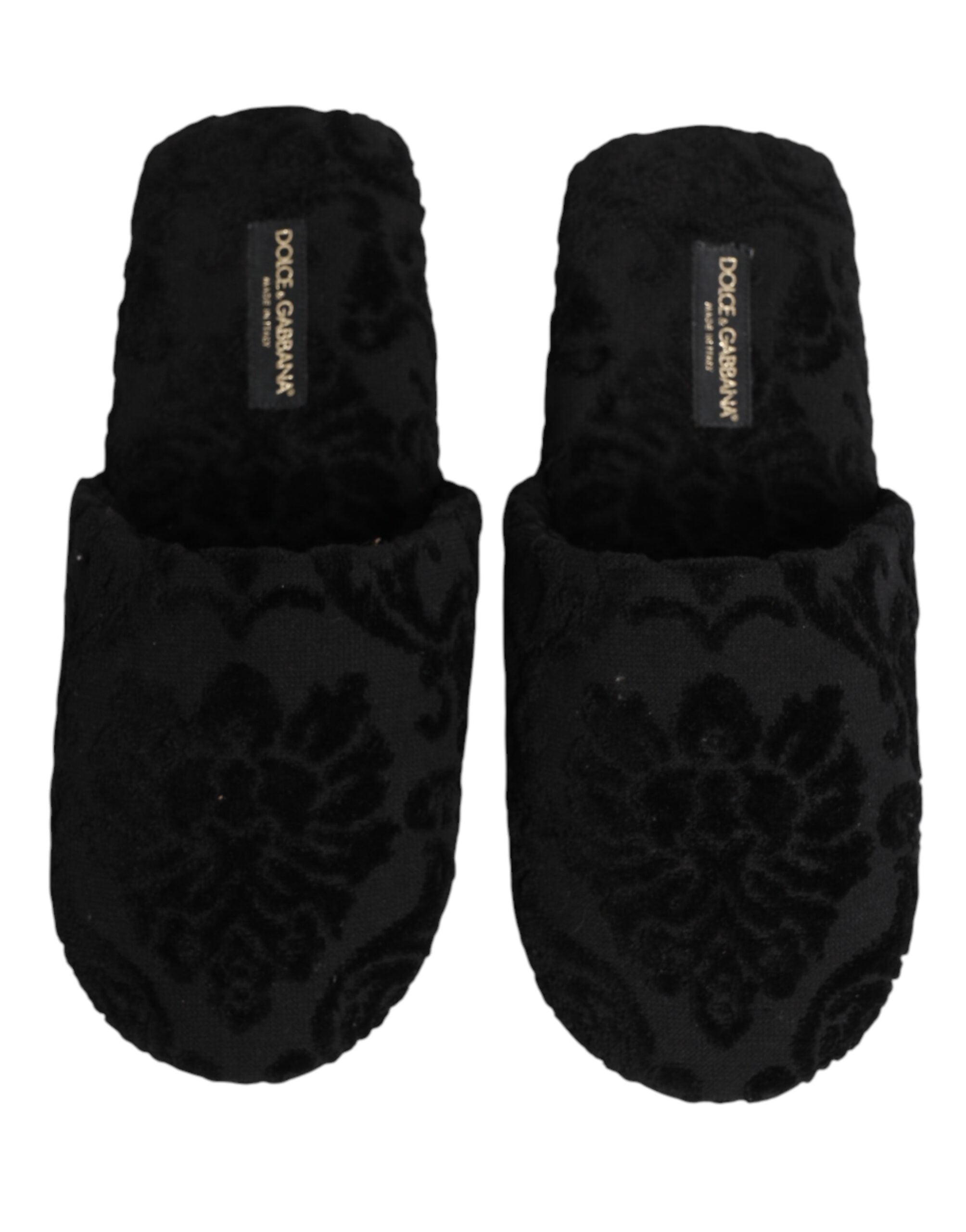 Chaussures slippers plates noires Dolce & Gabbana avec logo brodé, confortables et élégantes pour un style sophistiqué.