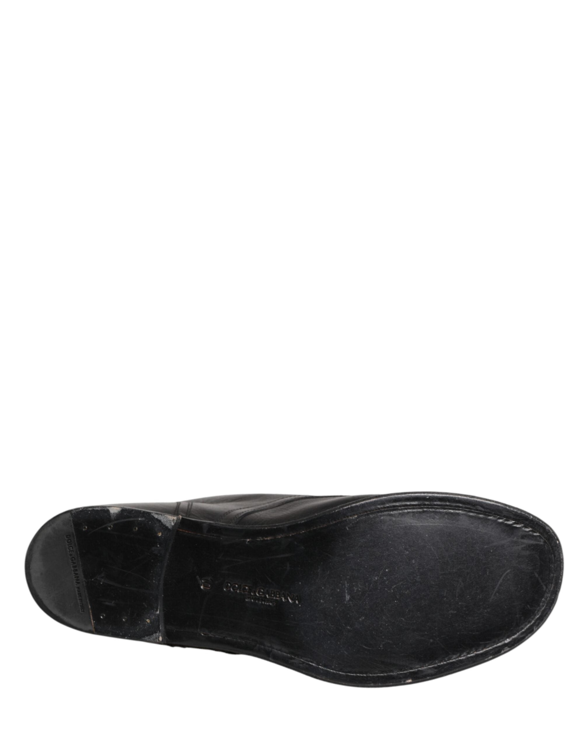 Chaussures homme Dolce & Gabbana bottines courtes en cuir noir à lacets, style élégant et moderne, vue de face.