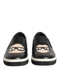Chaussures sneakers Dolce & Gabbana en cuir noir avec logo signature, design élégant et moderne, vue de face.