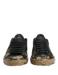 Chaussures sneakers basses Dolce & Gabbana Portofino noires avec effet boue, style décontracté et moderne.