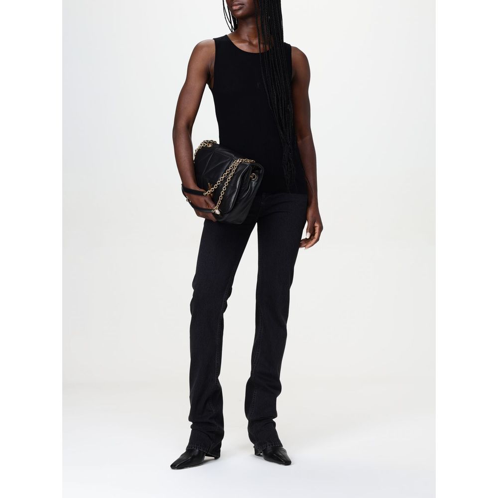 Jean droit en coton noir de la marque Saint Laurent, vue détaillée du tissu et de la coupe classique.