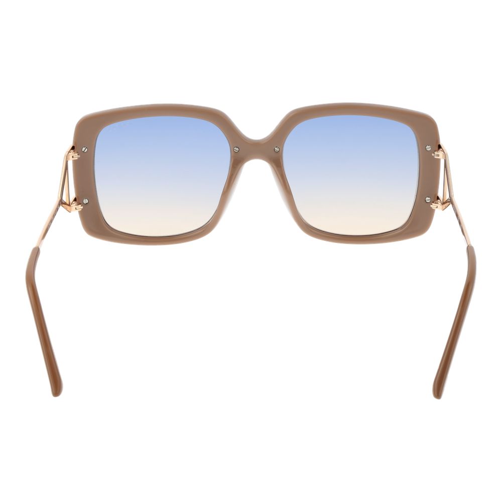 Lunettes de soleil Guess en métal et plastique brun, avec monture élégante et verres teintés, pour un style tendance et moderne.