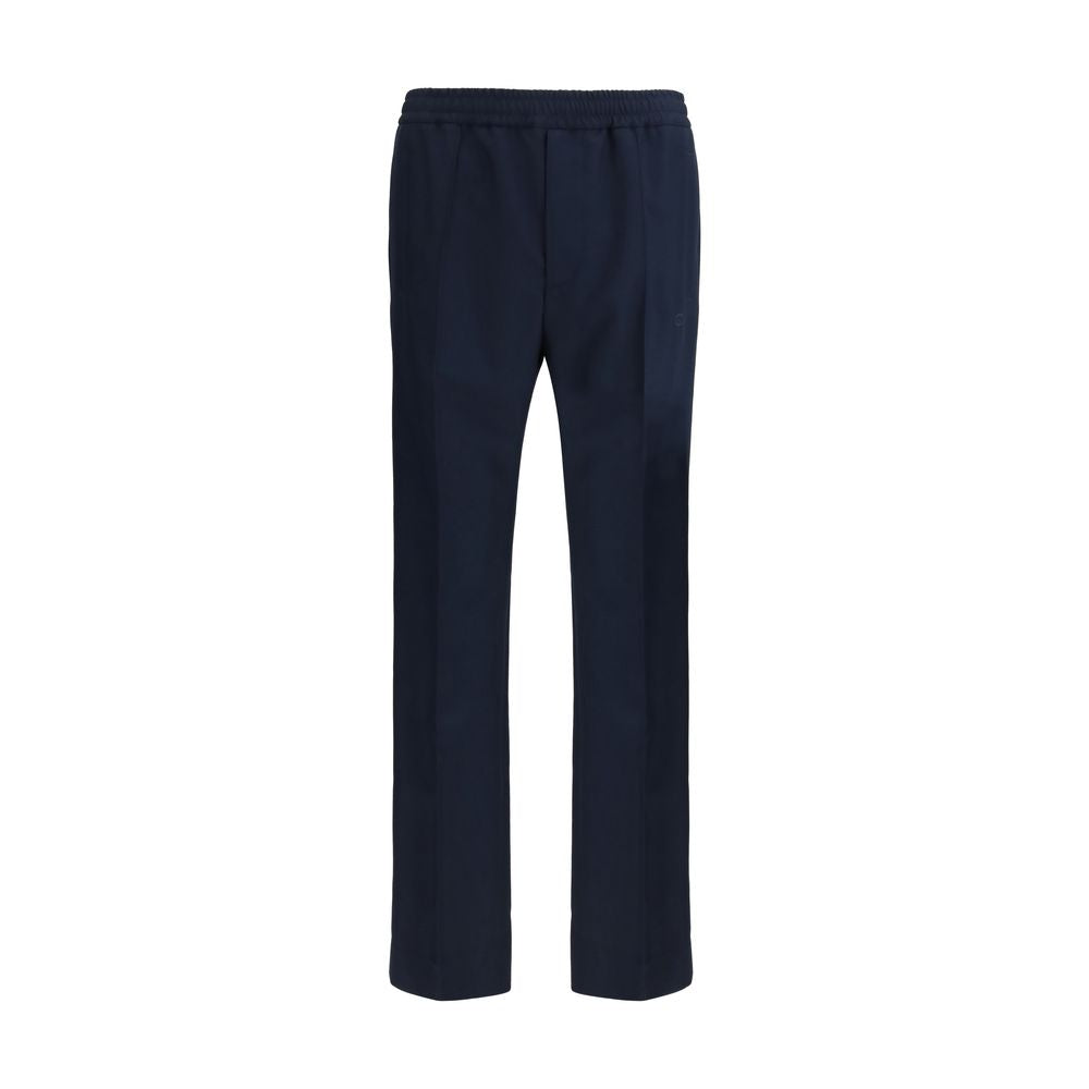 Pantalons décontractés en polyester bleu de Gucci, coupe confortable et style élégant, visibles sur cette image.