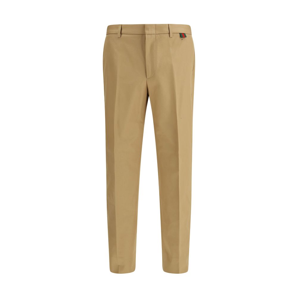 Pantalons décontractés en coton beige de Gucci, style casual avec coupe élégante, visibles sur l'image.