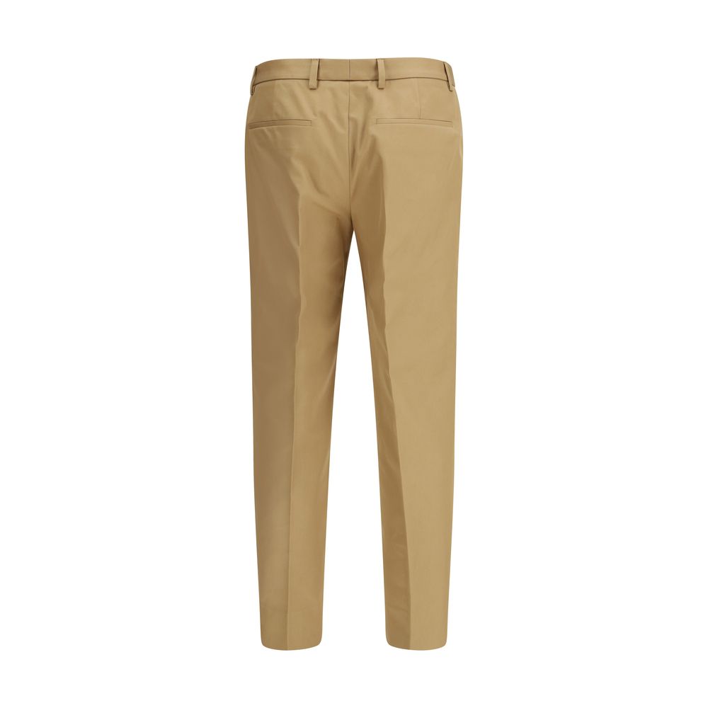 Pantalon décontracté en coton beige de Gucci, style casual avec coupe confortable et détails élégants.