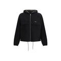 Veste en polyester noir Prada pour homme, coupe moderne, avec capuche et fermeture éclair visible sur l'image.