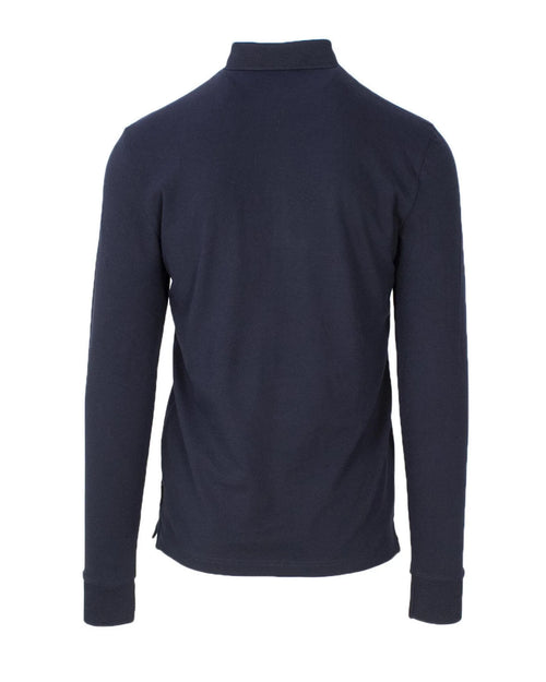 Chemise polo bleue en coton de la marque Armani Exchange, vue de face avec col et boutons visibles.